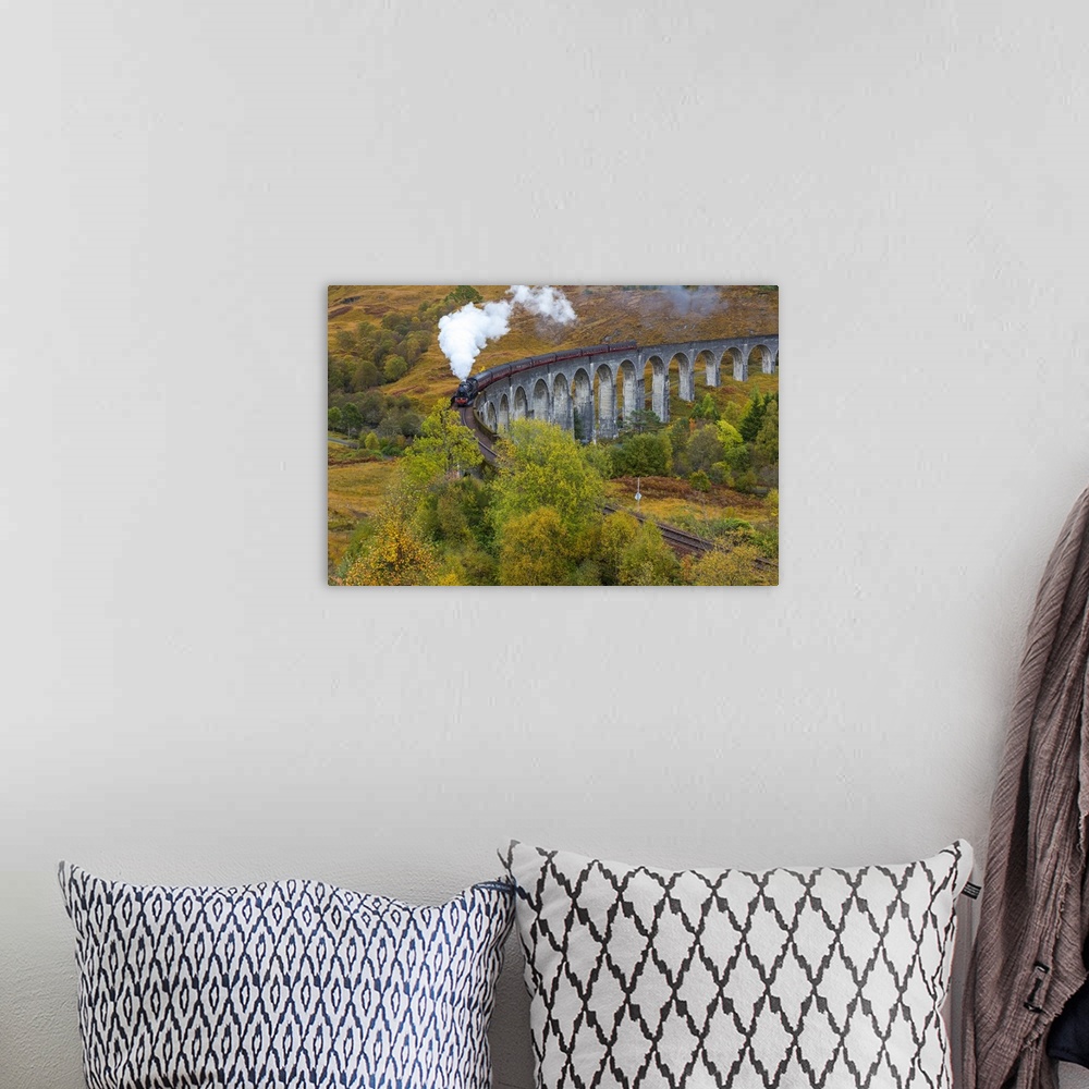 A bohemian room featuring Jacobite steam train crossing Glenfinnan viaduct, Lochaber, nr Fort William, Highlands, Scotland, UK