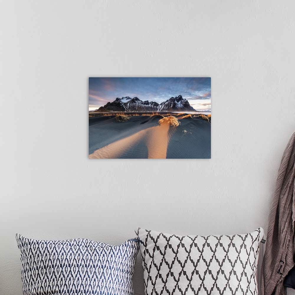 A bohemian room featuring Stokksnes, Hofn, East Iceland, Iceland. Vestrahorn mountain and the black sand dunes at sunset.