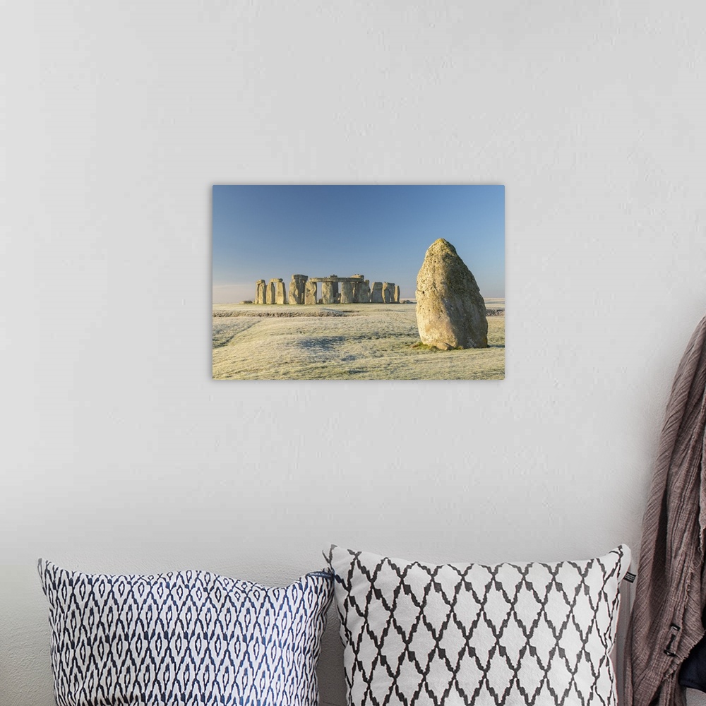 A bohemian room featuring Stonehenge and the Heel Stone at dawn on a chill frosty winter morning, Wiltshire, England. Winte...