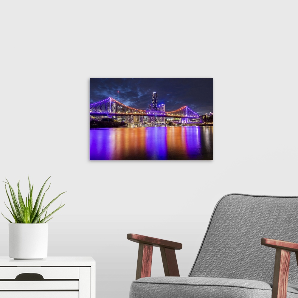 A modern room featuring Story Bridge and Brisbane River at dusk, Brisbane, Queensland, Australia.