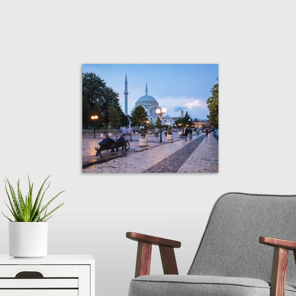 A modern room featuring Street scene with Exterior of Xhamia e Madhe Mosque in background, Old Town, Shkodra, Albania
