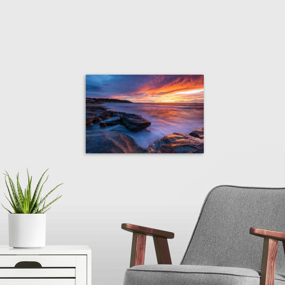 A modern room featuring Stunning sunrise looking over to Norah Head Lighthouse. Gravelly Beach, Central Coast, New South ...