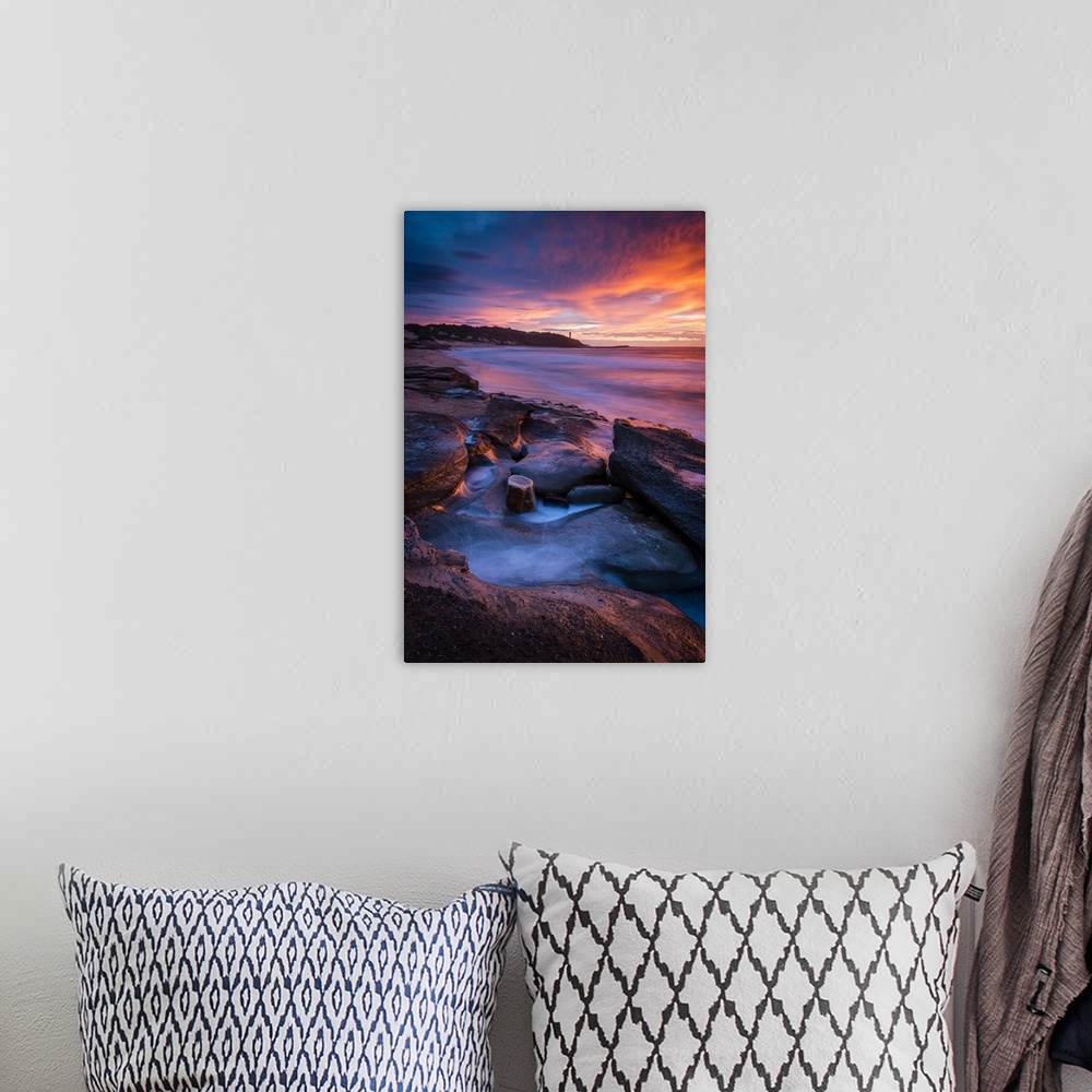 A bohemian room featuring Stunning sunrise looking over to Norah Head Lighthouse. Gravelly Beach, Central Coast, New South ...