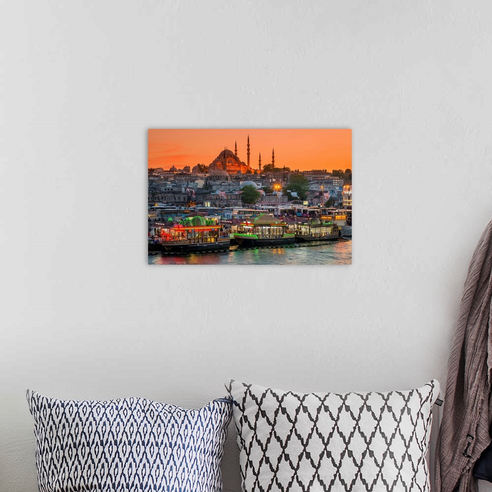 A bohemian room featuring Suleymaniye Mosque and city skyline at sunset, Istanbul, Turkey.