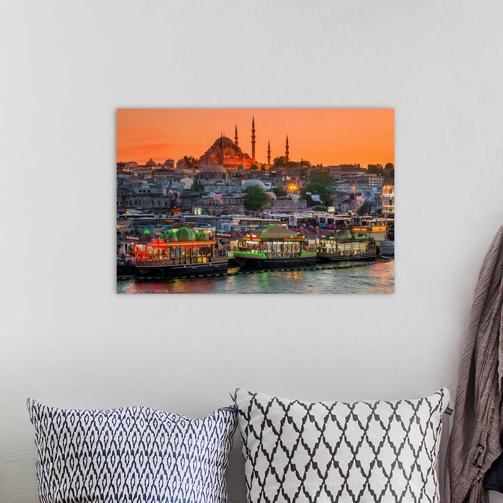 A bohemian room featuring Suleymaniye Mosque and city skyline at sunset, Istanbul, Turkey.