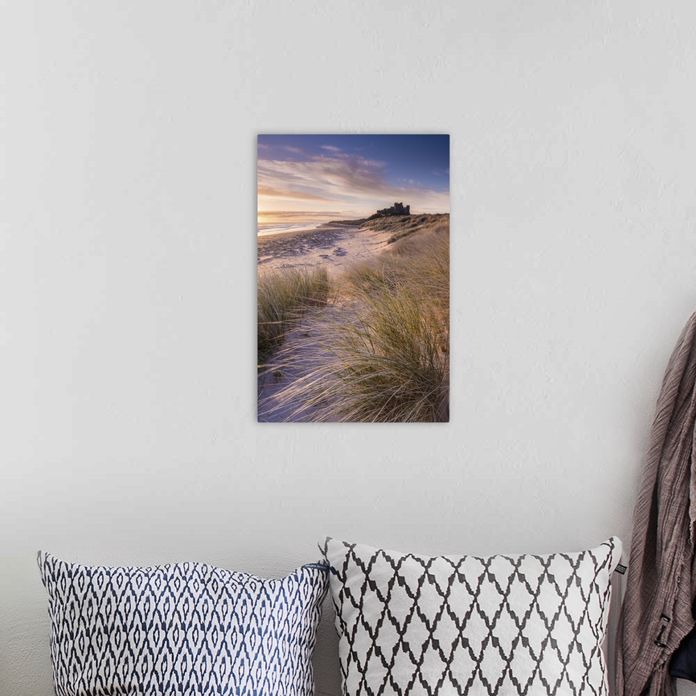 A bohemian room featuring Sunrise over Bamburgh Castle, Northumberland, England. Spring
