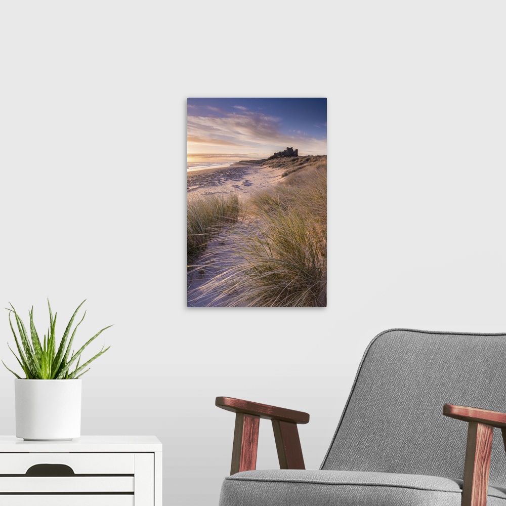 A modern room featuring Sunrise over Bamburgh Castle, Northumberland, England. Spring