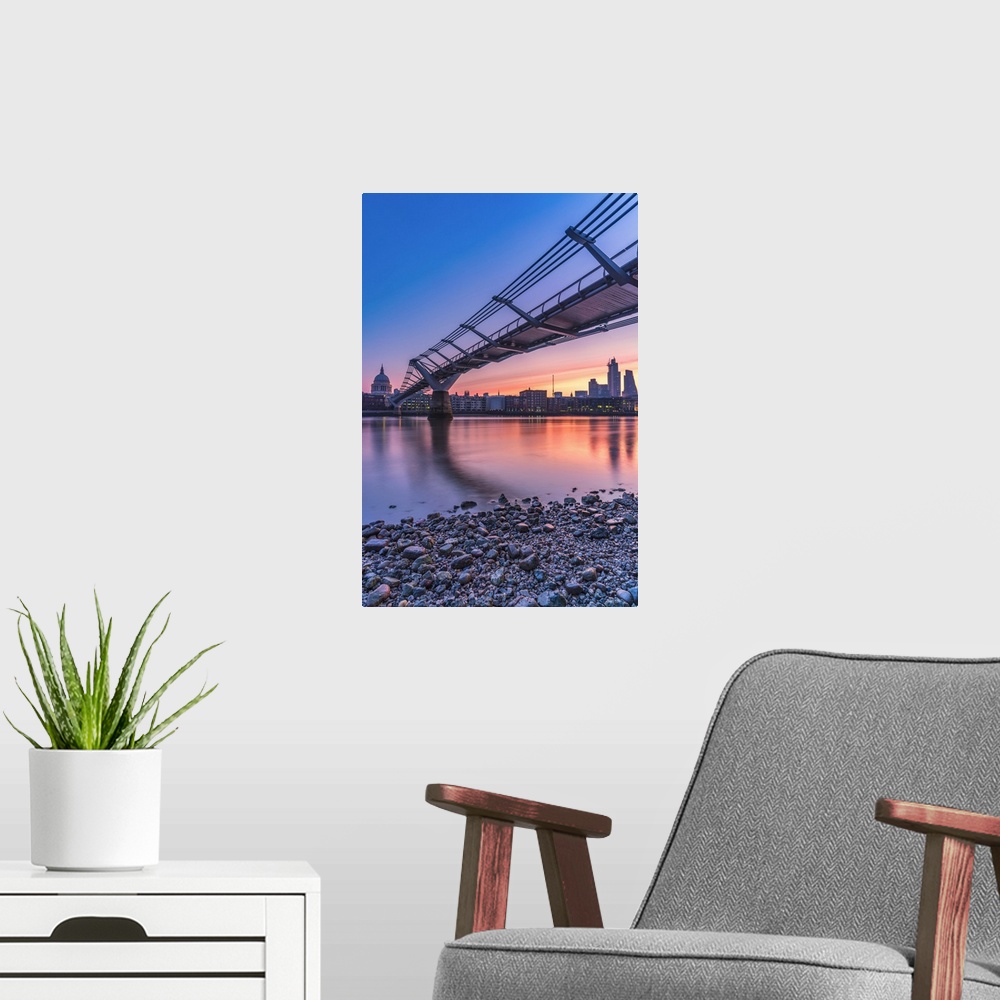 A modern room featuring Sunrise over Millennium Bridge, St Paul's Cathedral and financial district from banks of River Th...