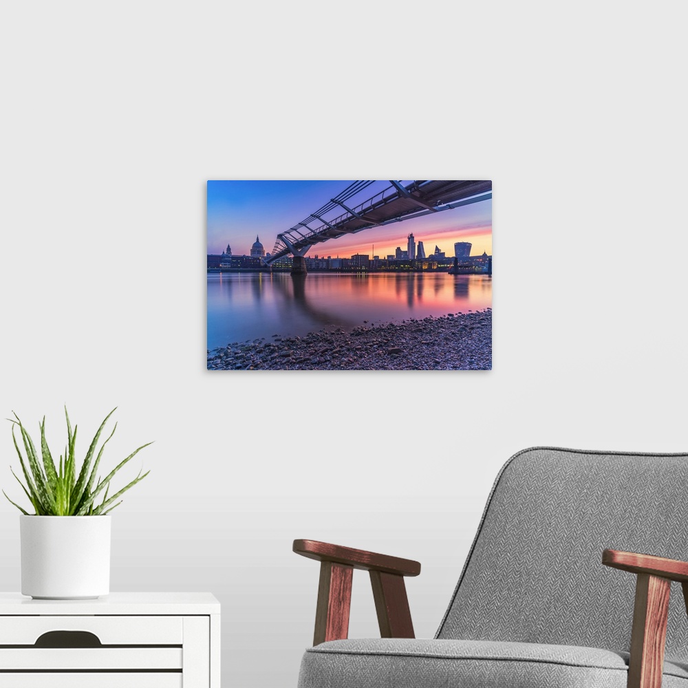 A modern room featuring Sunrise over Millennium Bridge, St Paul's Cathedral and financial district from banks of River Th...