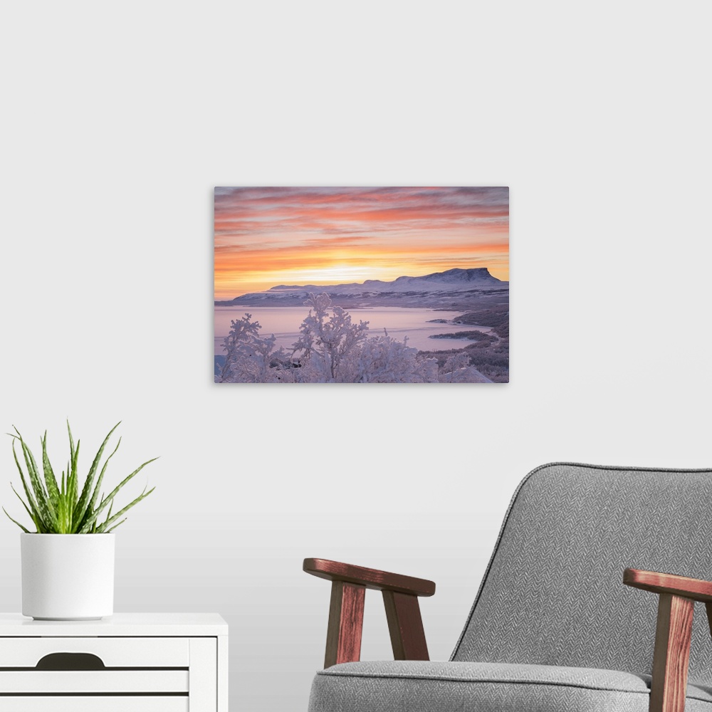 A modern room featuring Sunrise with burning sky, Abisko, Kiruna, Sweden, Europe