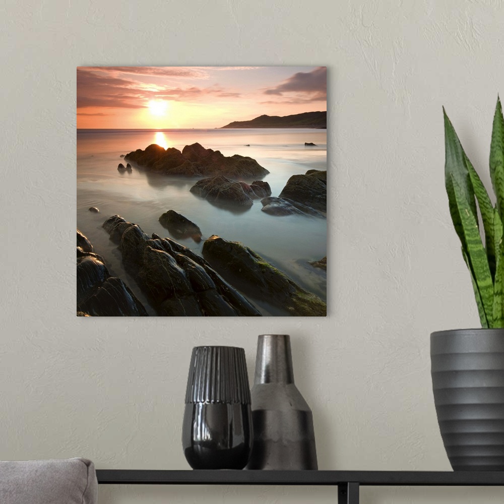 A modern room featuring Sunset on Barricane Beach, Woolacombe, Devon, England. Summer