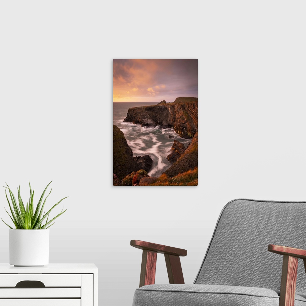 A modern room featuring Sunset over the dramatic cliffs of North Cornwall, England. Spring (May) 2021.