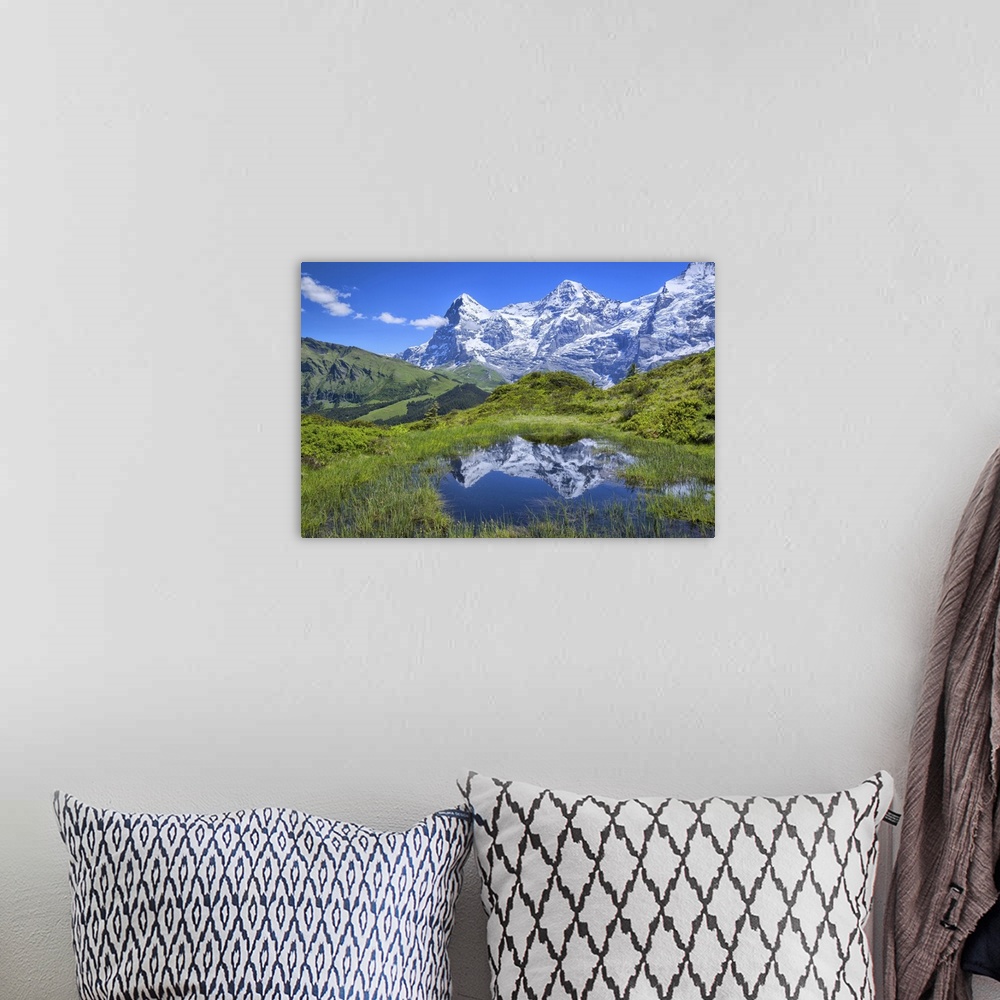 A bohemian room featuring Europe, Switzerland, Bern, Bernese Oberland, Reflection in pond with eiger.