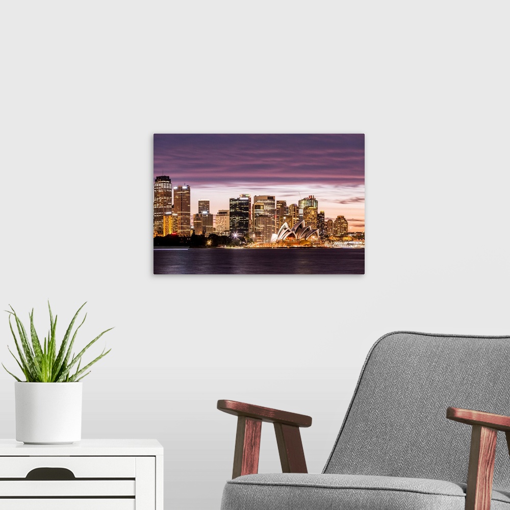 A modern room featuring Sydney at dusk. Opera house and cityscape skyline.
