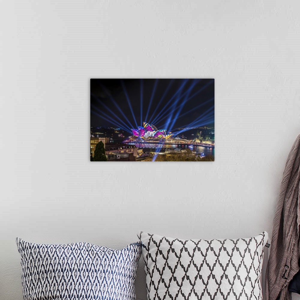 A bohemian room featuring Sydney Opera House illuminated with lasers and projections during Vivid Sydney festival, Sydney, ...