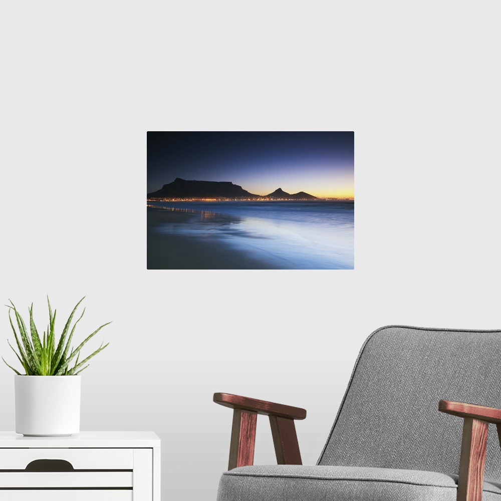 A modern room featuring View of Table Mountain at dusk from Milnerton beach, Cape Town, Western Cape, South Africa