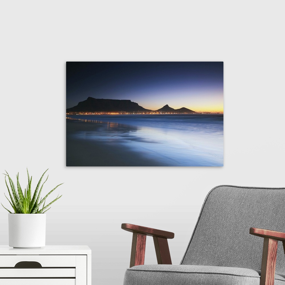 A modern room featuring View of Table Mountain at dusk from Milnerton beach, Cape Town, Western Cape, South Africa