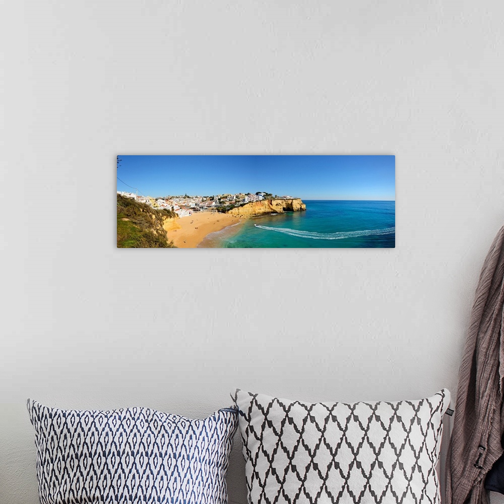 A bohemian room featuring The Beach And Village Of Carvoeiro. Lagoa, Algarve, Portugal