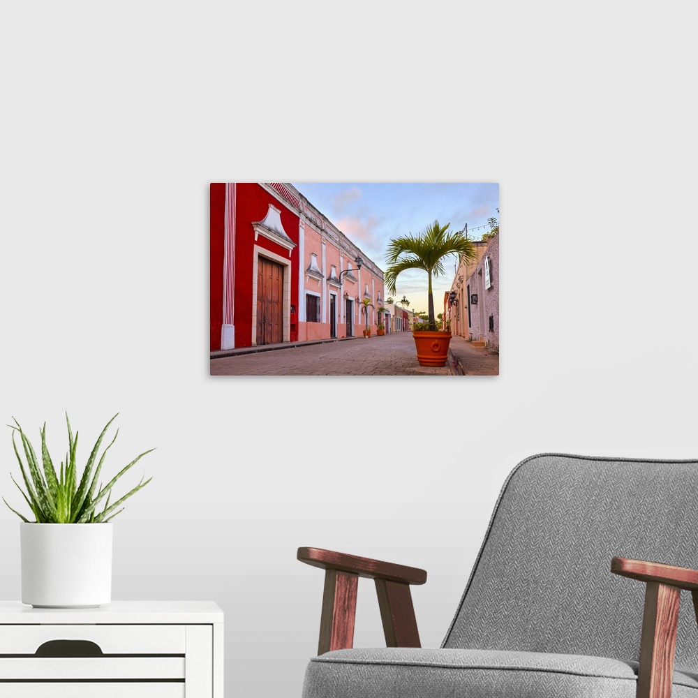 A modern room featuring The Calzada de los Frailes street at sunrise, Valladolid, Yucatan, Mexico.
