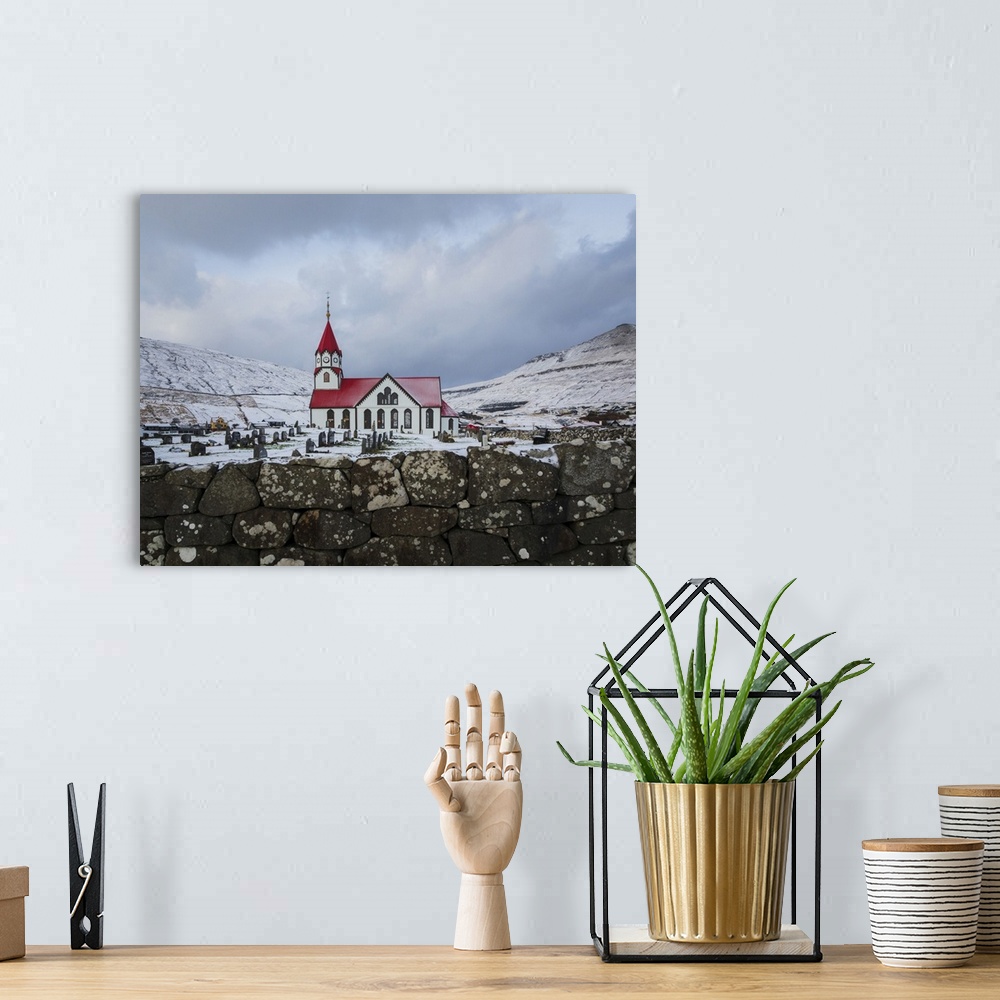 A bohemian room featuring The church in Sandavagur covered by snow, Vagar, Faroe Islands