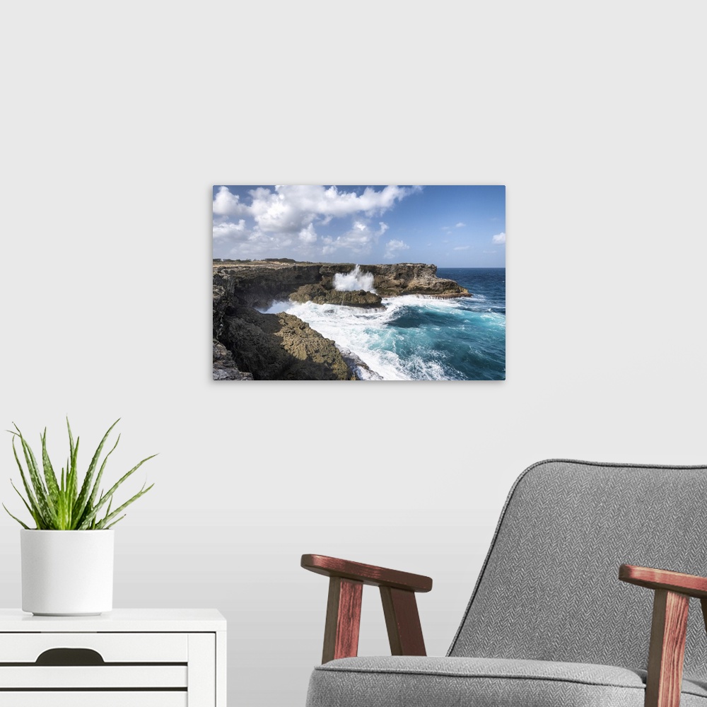 A modern room featuring The cliff in front of the big waves of Atlantic Ocean, North Point, Barbados Island, Lesser Antil...