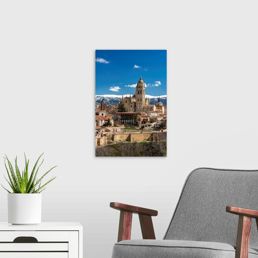 A modern room featuring City Skyline With The Gothic Cathedral And The Snowy Mountains Of Sierra De Guadarrama In The Bac...
