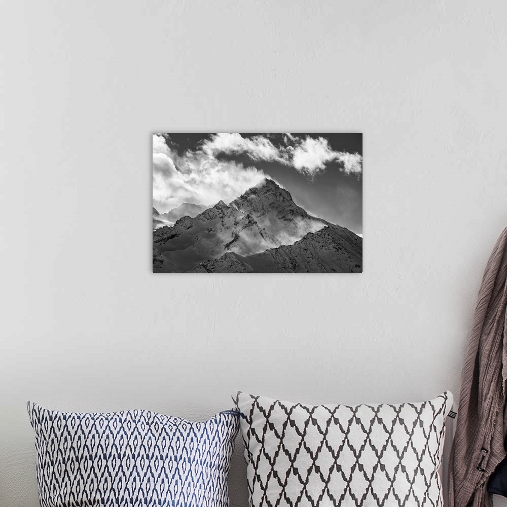 A bohemian room featuring The Grivola Peak during a windy day from the Couis peak, near Pila locality (Gressan municipality...