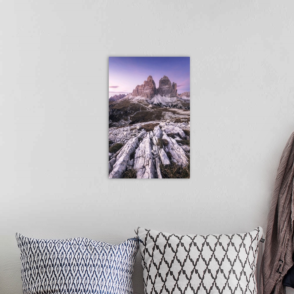 A bohemian room featuring The iconic Tre Cime di Lavaredo during a clear autumn sunset. Dolomites, Italy.
