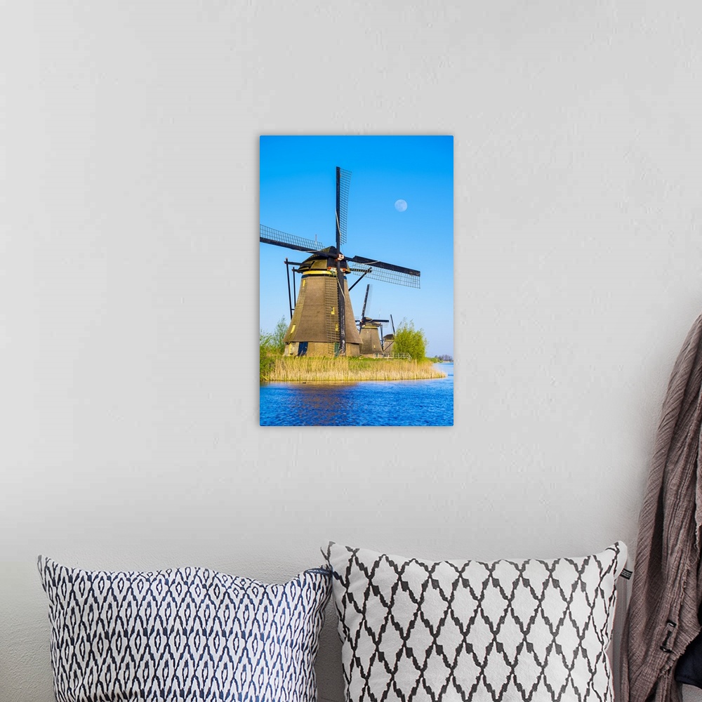 A bohemian room featuring Netherlands, South Holland, Kinderdijk, UNESCO World Heritage Site. The moon rises above historic...