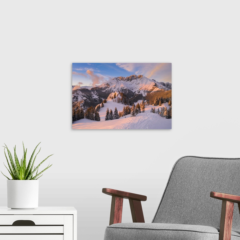 A modern room featuring Aerial view of the Presolana covered in snow at sunset from Mount Scanapa. Castione della Presola...