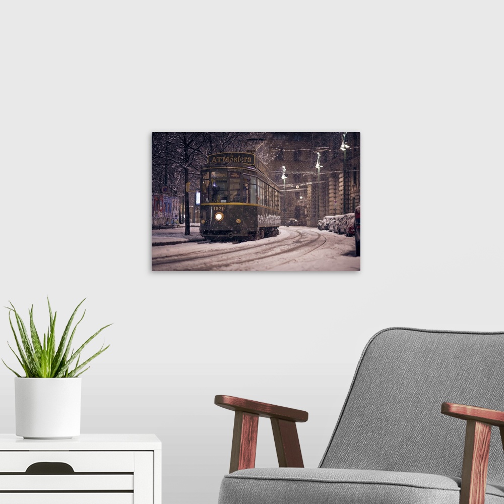 A modern room featuring The restaurant tram "ATMosfera" traveling in Piazza Castello in Milano during a heavy snowfall. L...