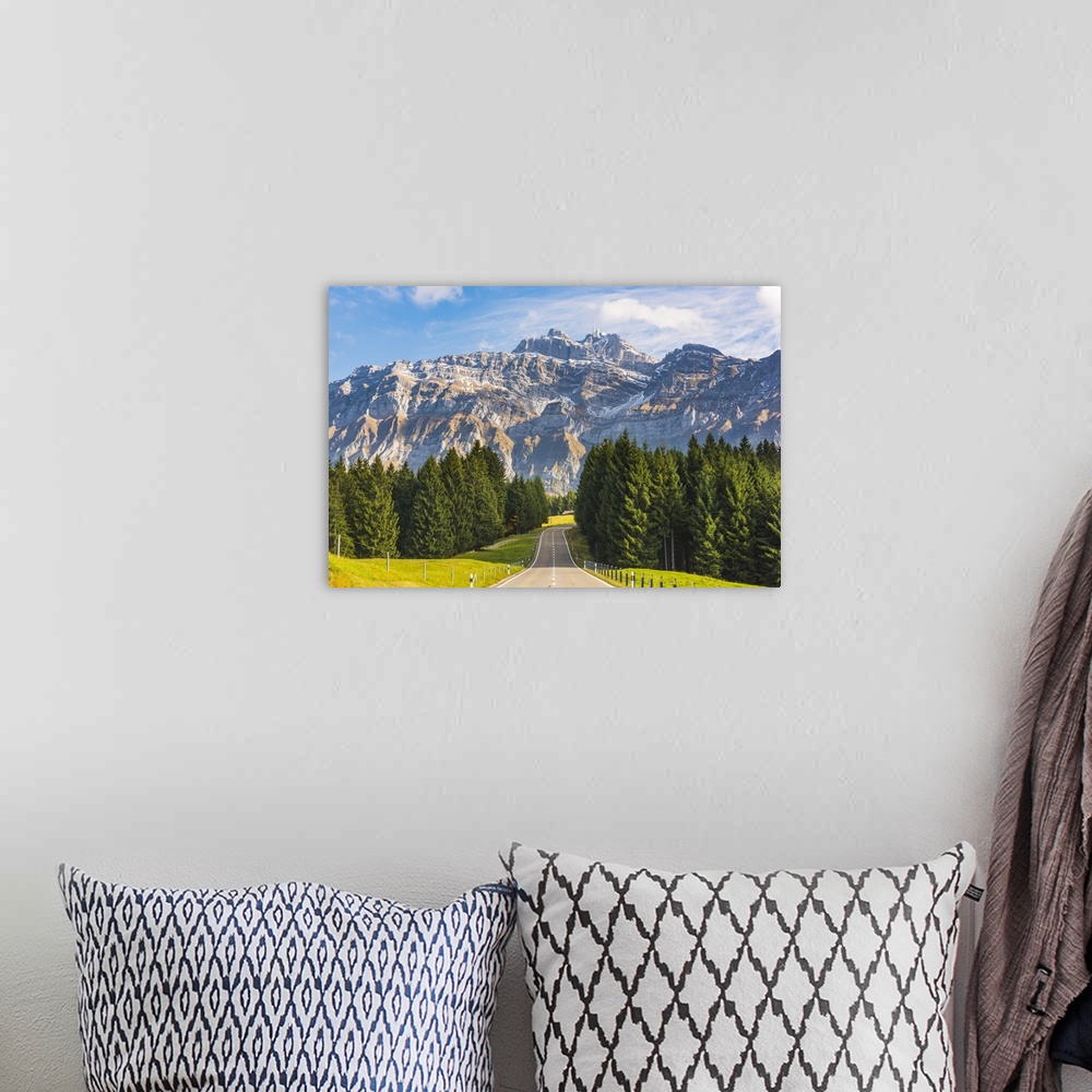 A bohemian room featuring The road leading to Schwagalp pass with mount Santis in the background, Switzerland.