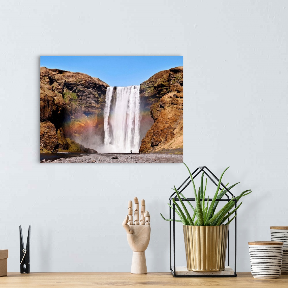 A bohemian room featuring The Skogafoss, one of the biggest waterfalls in the country with a width of 25 meters and a drop ...