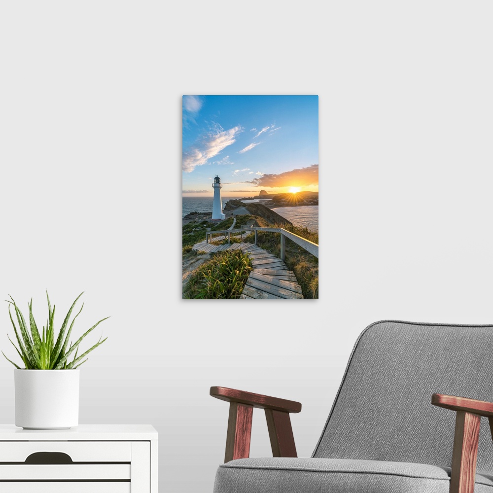 A modern room featuring The sun is setting down behind Castle Rock and Castlepoint lighthouse. Castlepoint, Wairarapa reg...