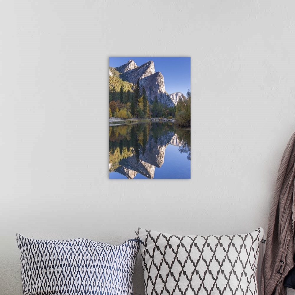 A bohemian room featuring The Three Brothers reflected in the Merced River at dawn, Yosemite Valley, California, USA. Autum...