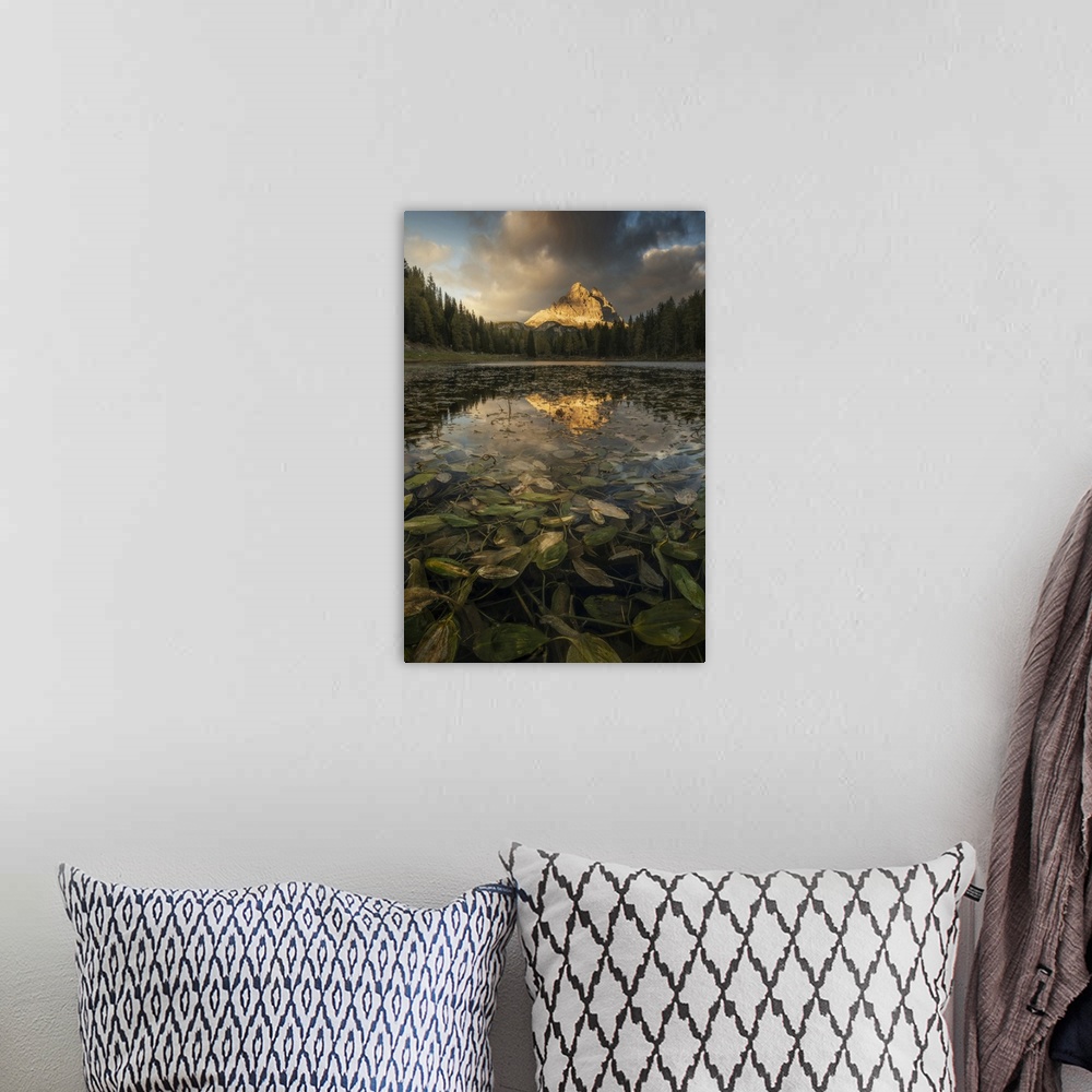 A bohemian room featuring The Tre Cime di Lavaredo reflecting in the Antorno lake during an early autumn sunset, with some ...