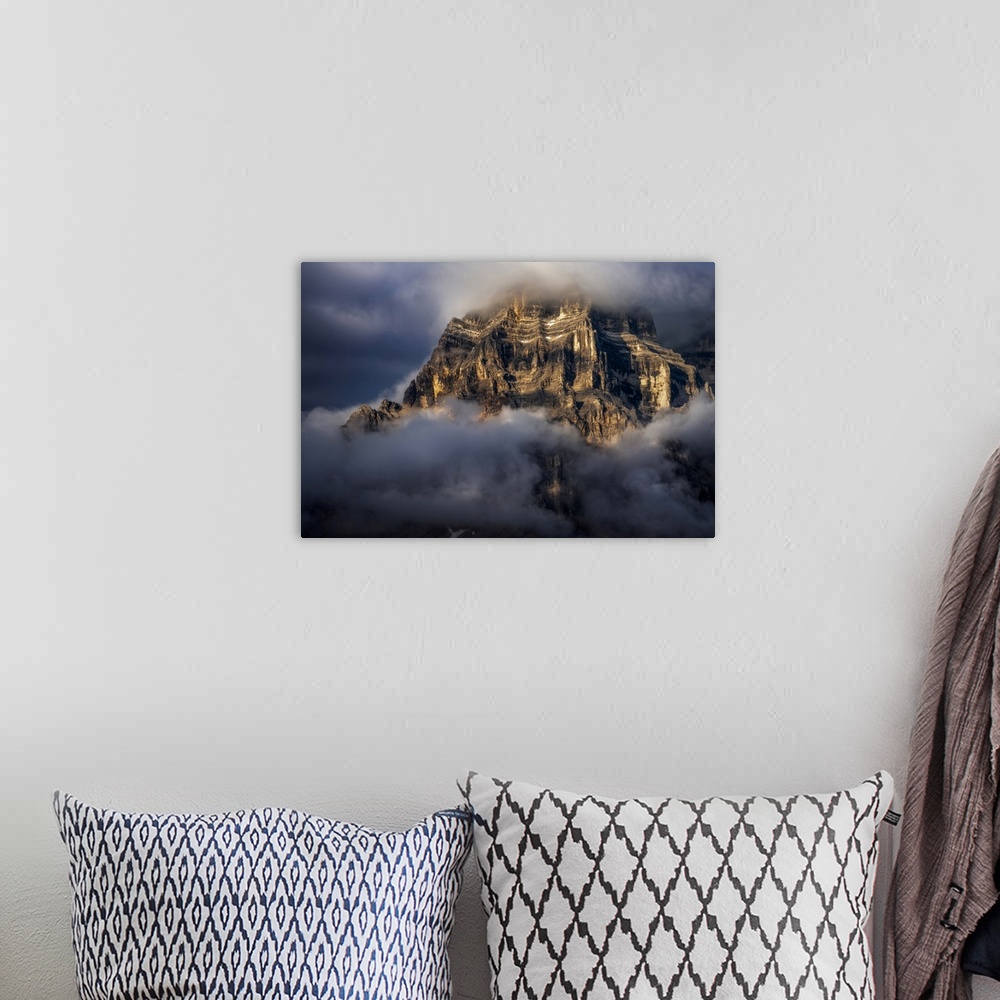 A bohemian room featuring The walls of Mt. Pelmo in the Italian Dolomites hit by the golden light during a clearing storm i...