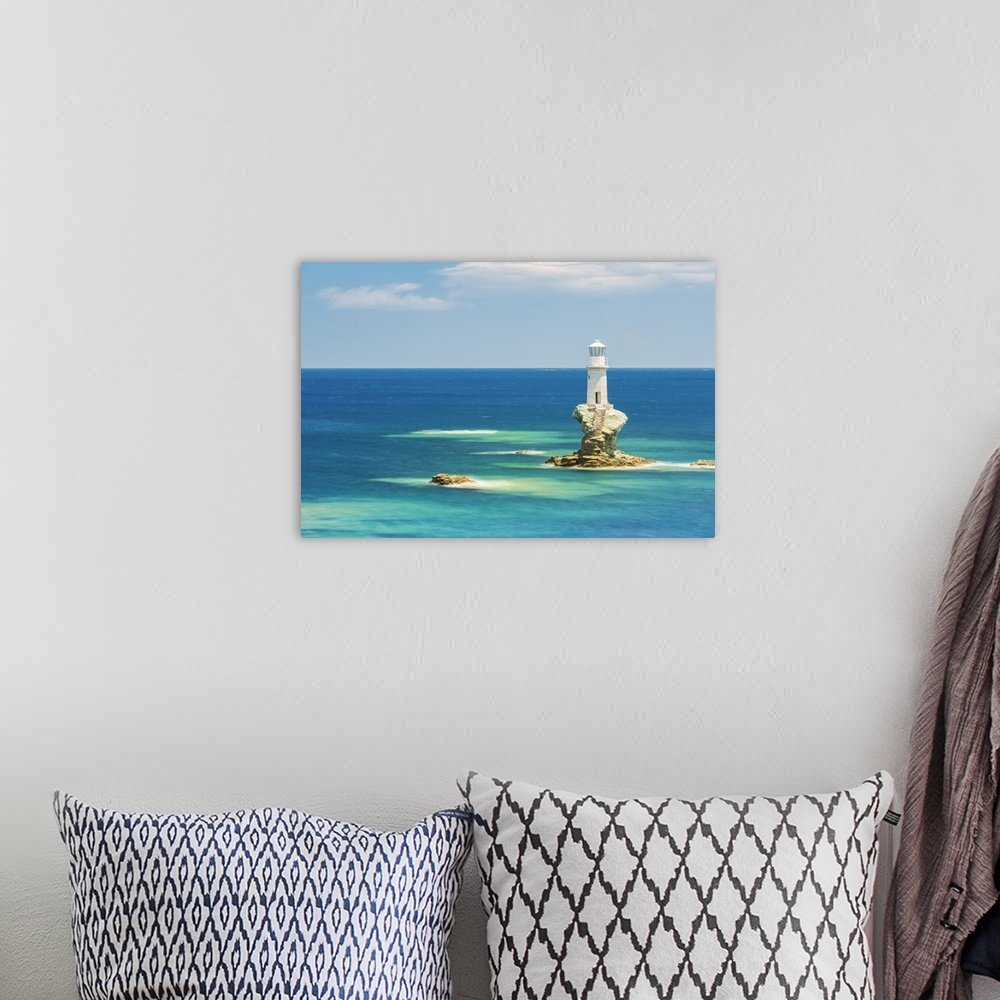 A bohemian room featuring Tourlitis lighthouse, the first automatic offshore lighthouse in Greece, Andros, Cyclades Archipe...