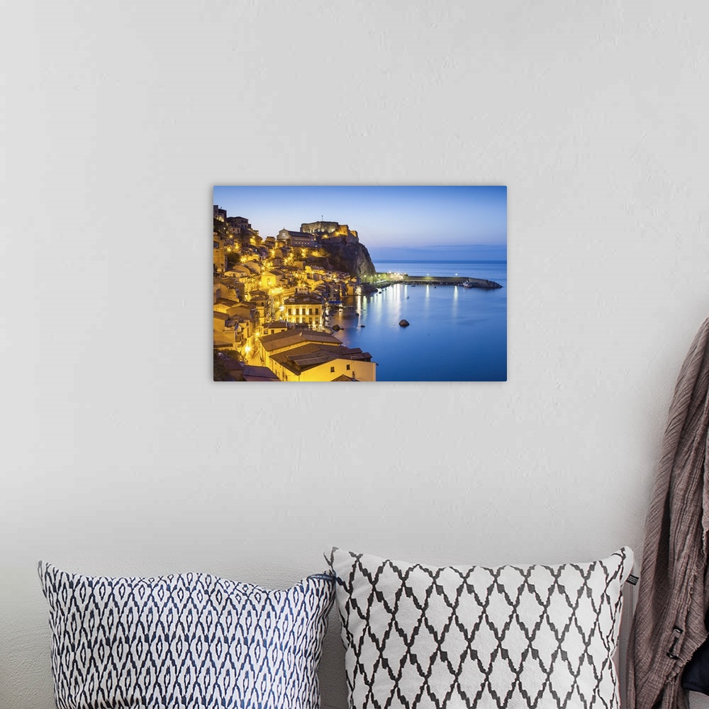 A bohemian room featuring Town View at dusk, with Castello Ruffo, Scilla, Calabria, Italy