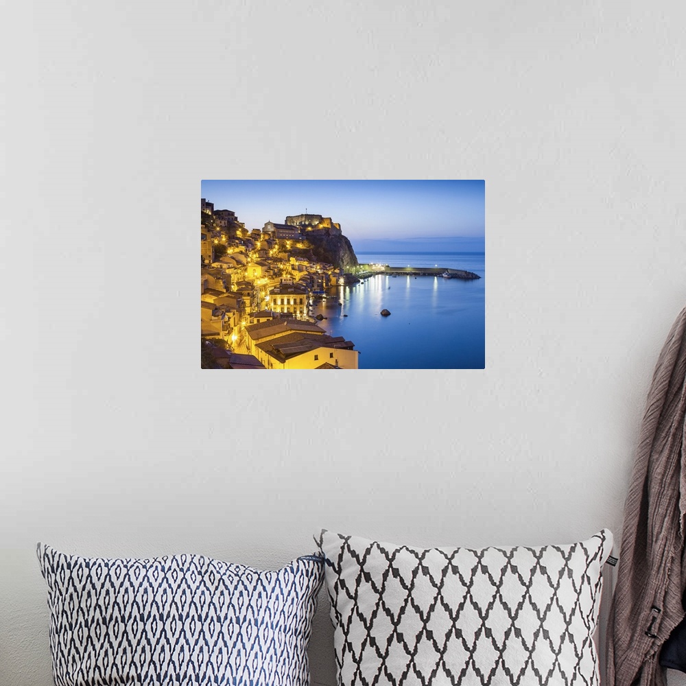 A bohemian room featuring Town View at dusk, with Castello Ruffo, Scilla, Calabria, Italy