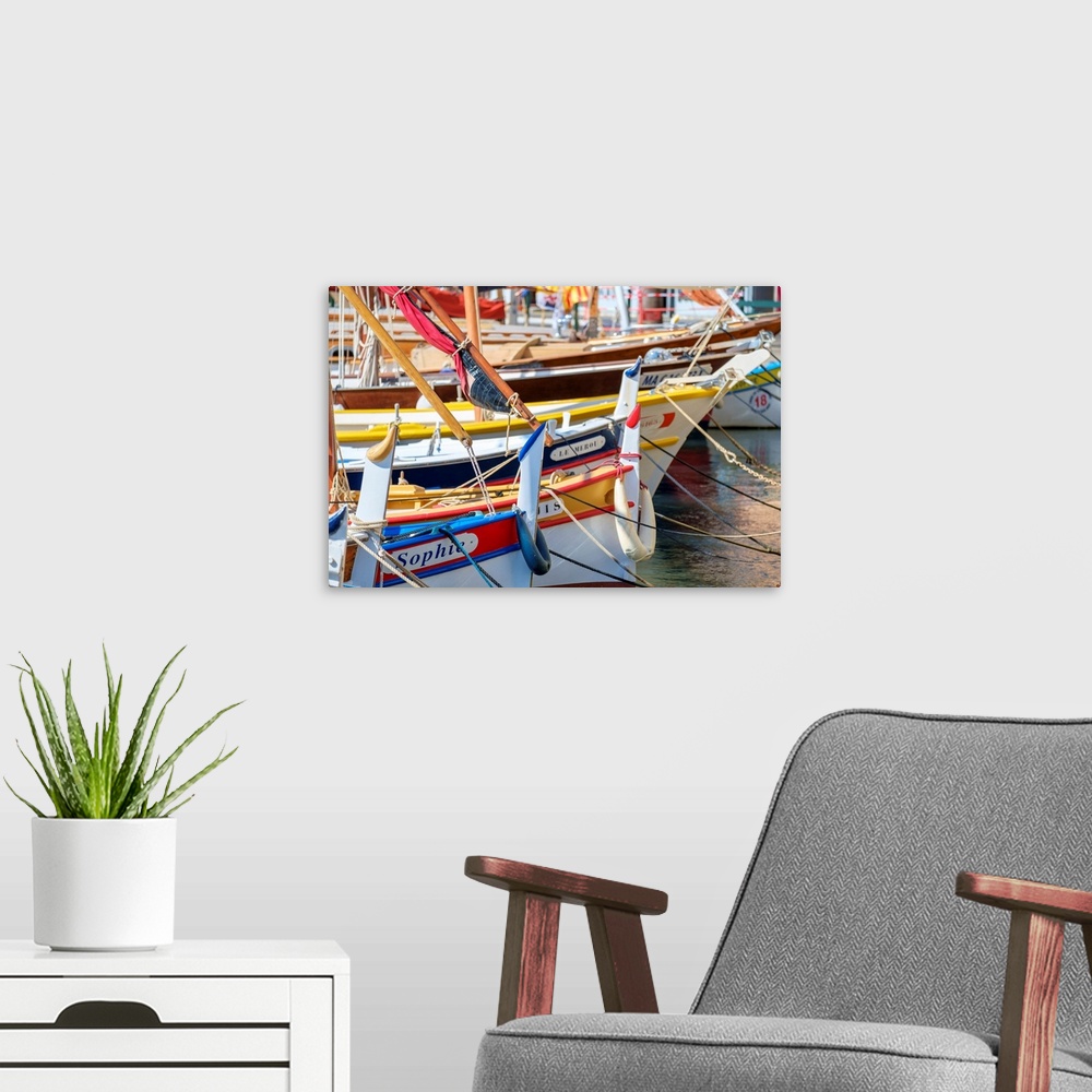 A modern room featuring Traditional colorful wooden fishing boat in the port harbor at Sanary-sur-Mer, Var department, Pr...