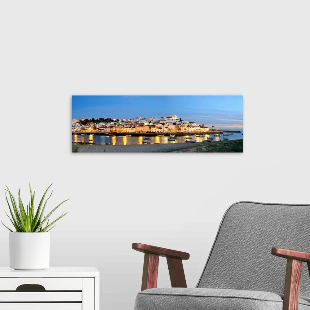 A modern room featuring The Traditional Fishing Village Of Ferragudo At Dusk, Bordering The Arade River. Algarve, Portugal