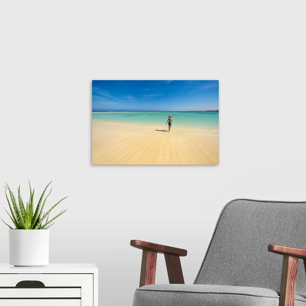A modern room featuring Turquoise Bay, Ningaloo Coast, Exmouth, Western Australia, Australia. Woman with straw hat on the...