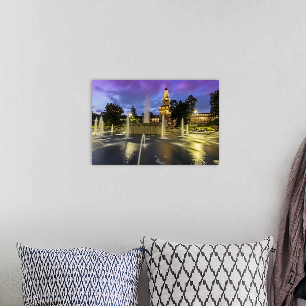 A bohemian room featuring Twilight view of Sforza Castle or Castello Sforzesco and fountain, Milan, Lombardy, Italy.