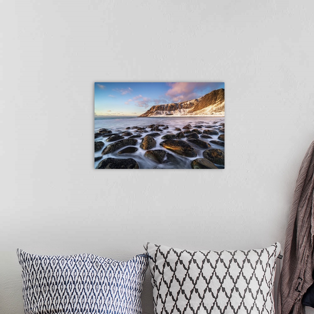 A bohemian room featuring Unstad Beach with Kleivheia mountain in the background in winter at sunset. Vestvagoy municipalit...