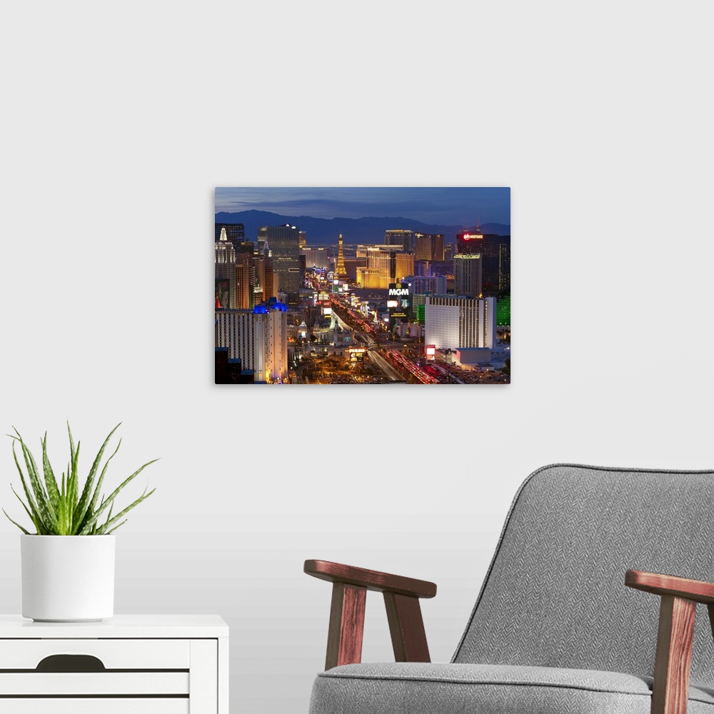 A modern room featuring United States of America, Nevada, Las Vegas, Elevated dusk view of the Hotels and Casinos along t...