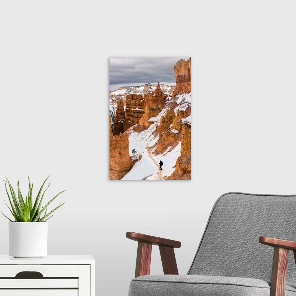 A modern room featuring USA, Utah, Man hiking through Bryce Canyon National Park.