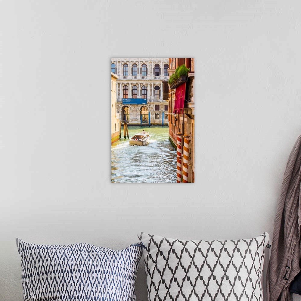 A bohemian room featuring Venice, Veneto, Italy. Buildings and boats in the canals. Ca' Pesaro Palace.