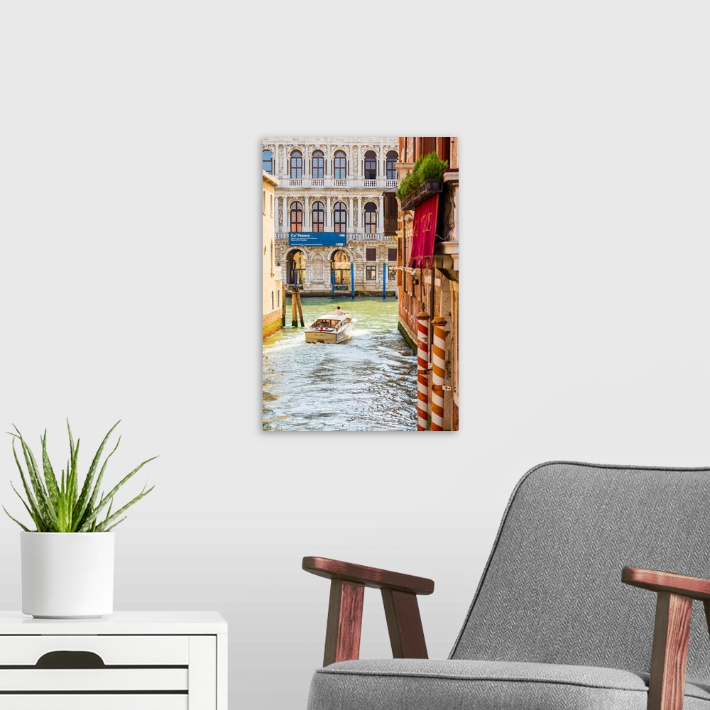 A modern room featuring Venice, Veneto, Italy. Buildings and boats in the canals. Ca' Pesaro Palace.