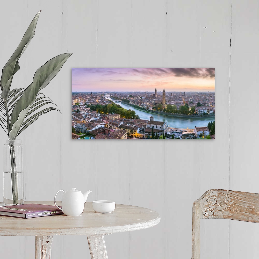 A farmhouse room featuring Verona, Veneto, Italy. High angle panoramic view of the old town and the Adige river at sunset.